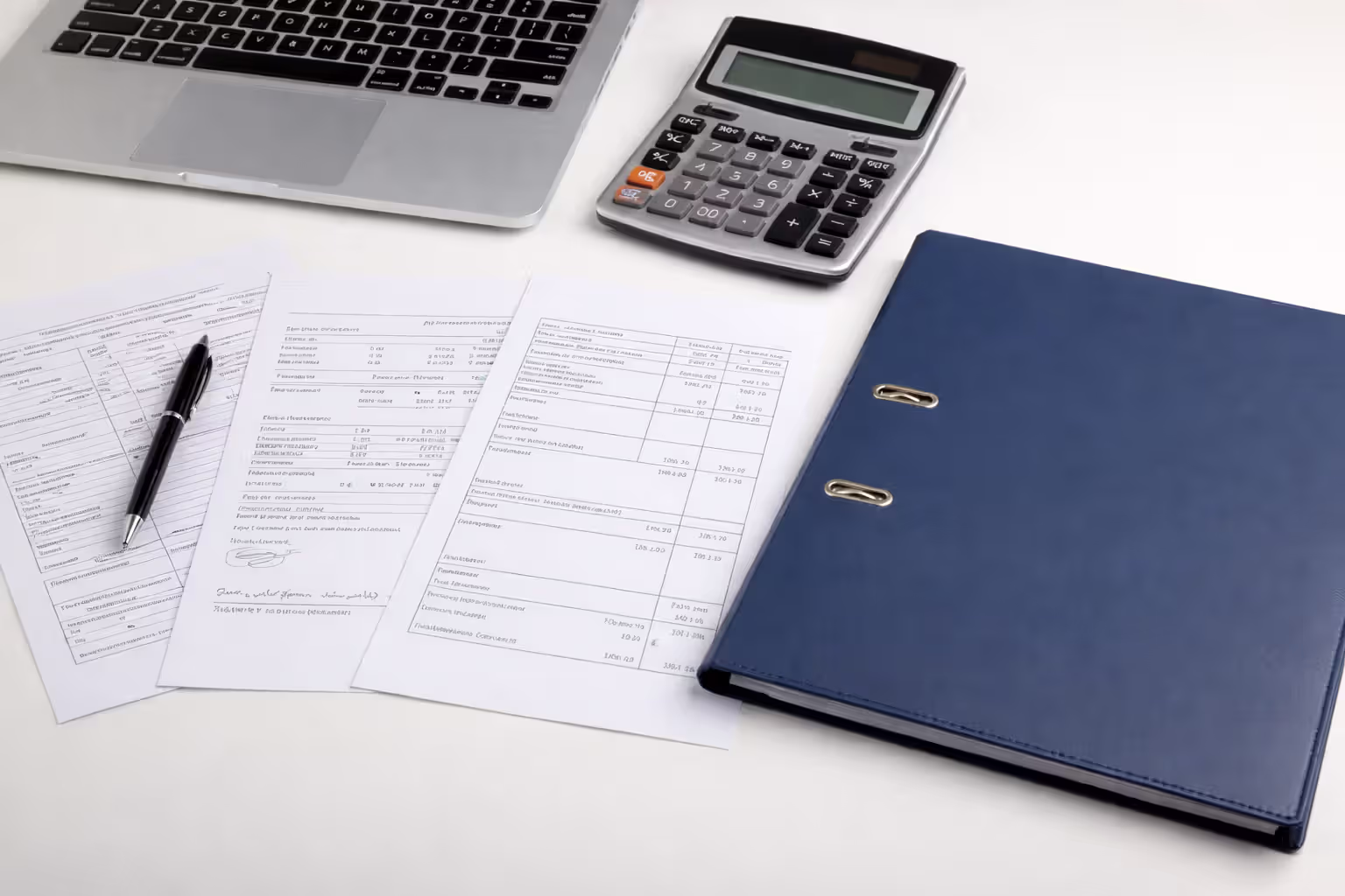 Financial documents prepared for car loan preapproval on a desk